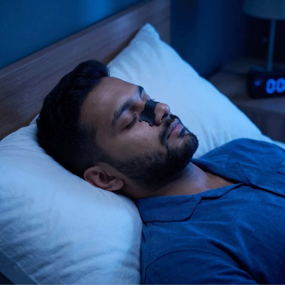 Person sleeping peacefully with nasal strip